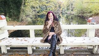 Tranny Mistresse NaomiPerv relaxing in the fall woods during the time that enjoying a smoke!