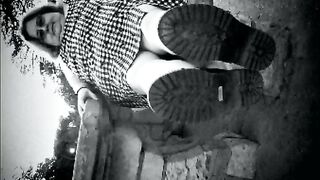 Nurse vicki models in her ebony and whot hogwarts outfit and spiked boots