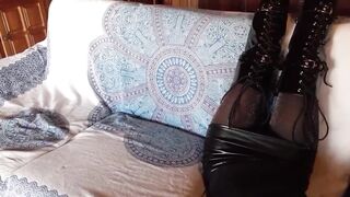 Total ebony with fishnets hose and boots over the knee