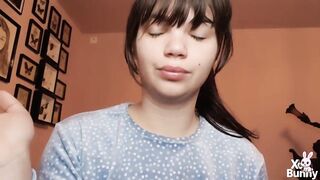 Brunette hair with natural large lips with natural color lipgloss smokin' a cigarette blowing smoke in your face