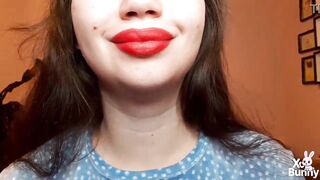 Natural lips with red lipstick smokin' a cigarette in close up