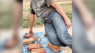 Taking a sneaky despairing public void urine outside with schlong thru jeans fly close to neighbors