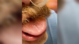 Tasting my own precum, I pour my collected precum onto my face and into my throat, bizarre close-up