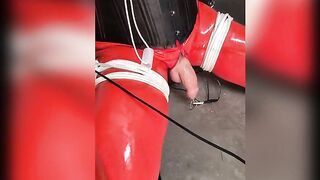 Dominated in red latex catsuit, ebony boots, frogtied and gagged, cum extraction with electro stimulation