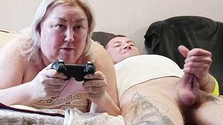 This guy interrupted his stepmom's game on the console, banged her in her throat and finished in it
