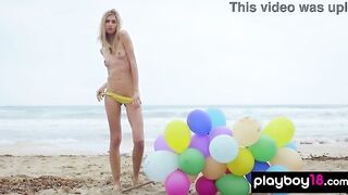 Tiny in nature's garb blondie enjoying the summer at the beach