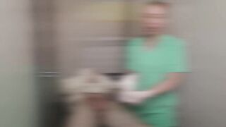 Gloved Nurse Sperm Extraction on Restrained Patient