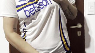 Getting warmed up in advance of the football match... female fan undressing...