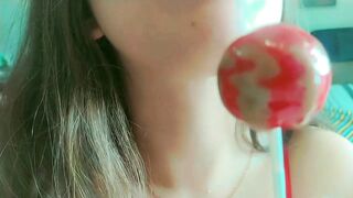 Just a cute and wicked hotty sucking lollipops, begging dad to cum on her throat . Throat close up