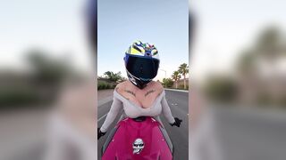 hot biker hotty does soaked t-shirt contest on her bike whilst riding