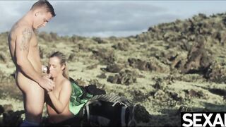 Cute golden-haired bangs fortunate boyfriend in wild volcanic landscape