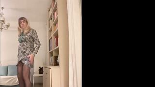 Glamorous Spanish trans woman positions seductively in the living room wearing high red heels and a hawt costume