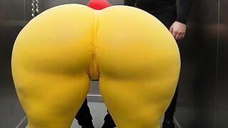 Large Butt Latin babe in Constricted Yellow Leggings Dancing in the Elevator