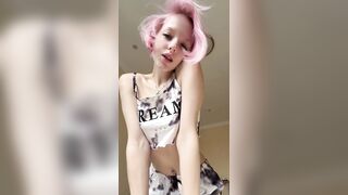 Pink haired beauty bows over showing booty