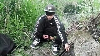 Cute Oriental homo twink in a ebony-and-white adidas tracksuit and Campus sneakers masturbates and cums outdoors