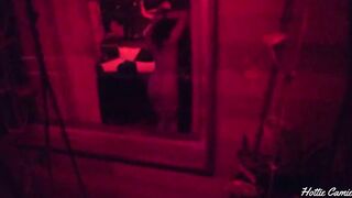 I record a hot beauty from the bedroom window as this babe masturbates.