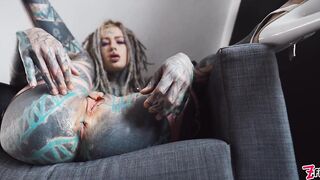 Beautiful tattooed cutie screws her butt with a large vibrator