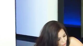 Brunette hair in mesh top fingers her cunt