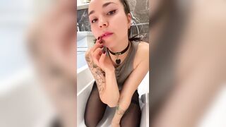 Tattooed hotty in nylons teases with her finger ?