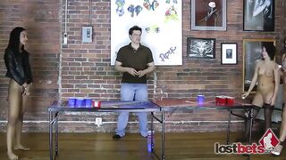 4 Charming beauties play a game of undress beer pong