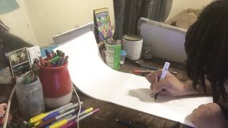 Youthful ebony boy draws breast.