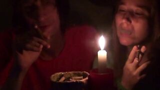 Pair smoke next to candle