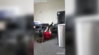 Transvestite sticking his head in the trash