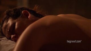 Lesbo fingering in a massage movie scene