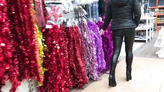 Amateur gal with leather leggings searching for a flawless Christmas tree