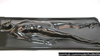 Fine sexy rubber beauty in full encased in ebony latex catsuit enjoys her vacuum daybed vacbed