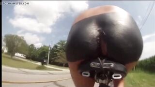 Bare bike ride on the road with massive buttplug, passing cars