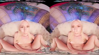 Large tit golden-haired plays with her toys in virtual reality