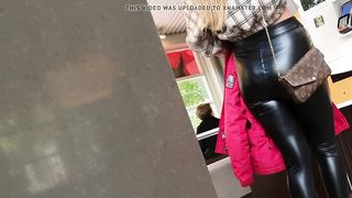 Blond bitch showing her extraordinary taut leather booty in public