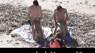 Voyeur on public beach. Group sex in advance of spectators