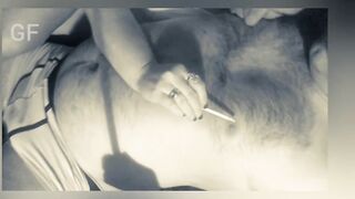 This guy smokes a cigarette and licks his lover's teats