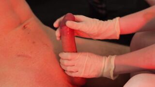 Mercilessly playing with his jock in medical gloves